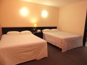 Postel nebo postele na pokoji v ubytování Hotel Lizbeth + 17 fotografií