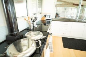 a kitchen with two sinks on a counter at Turnstone Beach House in Loorana