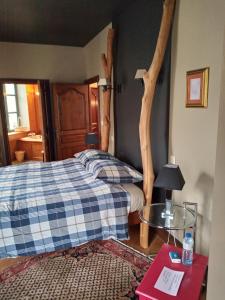 Postel nebo postele na pokoji v ubytování L'Ancien Hôtel