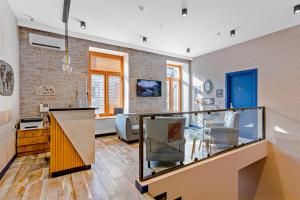 a living room with a large aquarium in the middle at Monument1880 in Tbilisi City