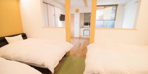 Postel nebo postele na pokoji v ubytování Kyo-Anthu Inn + 37 fotografií