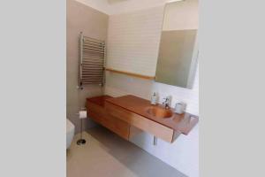 a bathroom with a sink and a mirror at Chiara Home Sorrento in Sorrento +24 photos