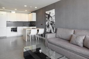 a living room with a couch and a table at FeelFree STAYS Basoa in Donostia-San Sebastián