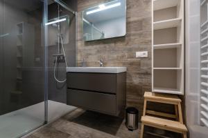 a bathroom with a sink and a shower at Apartmány ABIES - Štrbské Pleso in Štrbské Pleso +24 photos