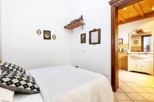 מיטה או מיטות בחדר ב-La casa di Lo