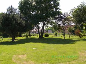 a park with trees and a field of grass at chez gourbeix in Arpheuilles-Saint-Priest