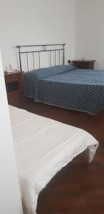 A bed or beds in a room at Il villino2