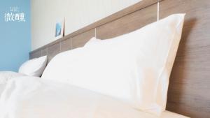 Postel nebo postele na pokoji v ubytování 金門微醺民宿 Kinmen TipsyHotel B&B