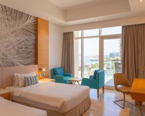 Royal Central Hotel and Resort The Palm客房内的一张或多张床位