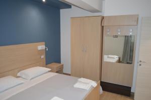 En eller flere senge i et værelse på Villa Baia dei Gruccioni