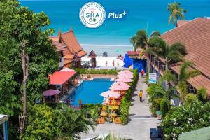 an image of a resort with a swimming pool and a beach at Sunrise Resort- Koh Phangan - SHA Extra Plus in Haad Rin