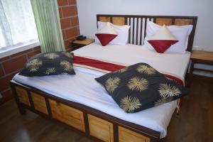 Postel nebo postele na pokoji v ubytování Altius Nest Hotel