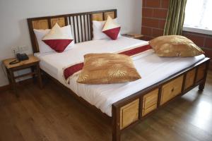 Postel nebo postele na pokoji v ubytování Altius Nest Hotel
