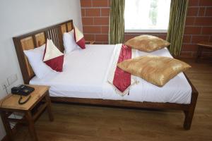 Postel nebo postele na pokoji v ubytování Altius Nest Hotel