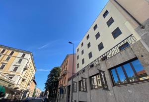 a building on the side of a city street at YellowSquare Milan in Milan