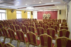 a room with rows of chairs in a room at I Residency in Puducherry