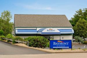 a building with a bank sign in front of it at Baymont by Wyndham North Dartmouth in North Dartmouth