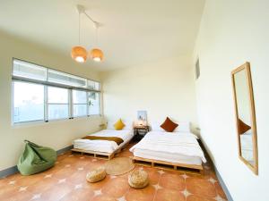Una cama o camas en una habitación de 亀居Kameshuku 寵物友善