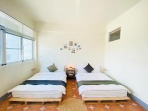 Una cama o camas en una habitación de 亀居Kameshuku 寵物友善