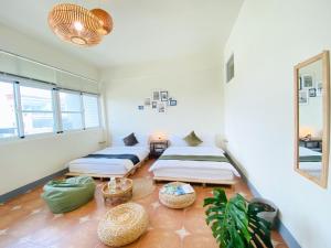 Una cama o camas en una habitación de 亀居Kameshuku 寵物友善