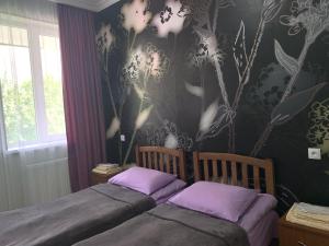 A bed or beds in a room at Guest House Demma