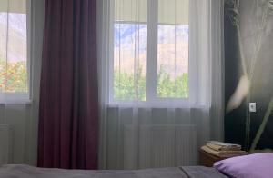A bed or beds in a room at Guest House Demma