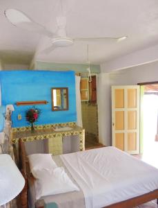 En eller flere senge i et værelse på Altamira Mazunte