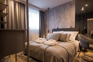 Łóżko lub łóżka w pokoju w obiekcie ApartView Plażowa Residence Szczyrk by Rent like home