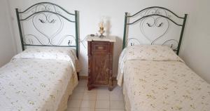 Posteľ alebo postele v izbe v ubytovaní terra rossa casa di campagna con piscina