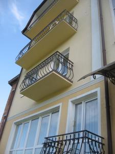 a building with balconies on the side of it at Vian Guest House in Truskavets