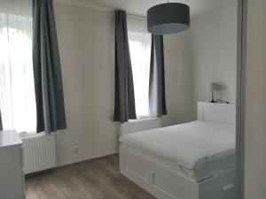 Postel nebo postele na pokoji v ubytování Znojmo apartmány