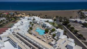an aerial view of a resort and the beach at Hotel Lanzarote Village in Puerto del Carmen