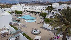 an aerial view of a hotel with a swimming pool at Hotel Lanzarote Village in Puerto del Carmen