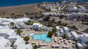 an aerial view of a resort with a swimming pool at Hotel Lanzarote Village in Puerto del Carmen