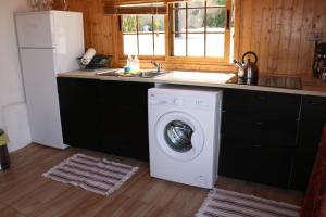 A kitchen or kitchenette at Half wooden rural apartment