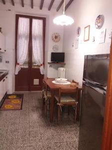 TV a/nebo společenská místnost v ubytování Casa Tarrini