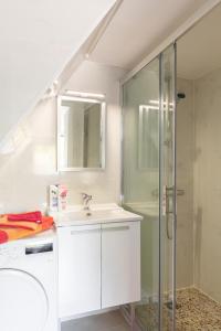 a bathroom with a sink and a shower at Trendy studios Tassin in Tassin-la-Demi-Lune +75 photos