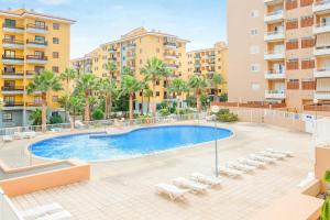 an image of a swimming pool in front of apartment buildings at Apartamento Deluxe in Candelaria