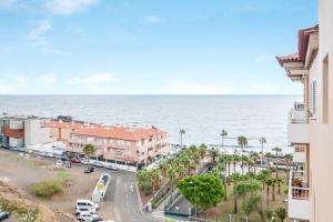 a view of the ocean from a building at Apartamento Deluxe in Candelaria