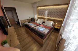 Katil atau katil-katil dalam bilik di Hotel Gól Prostějov