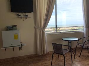 TV a/nebo společenská místnost v ubytování Hotel Las Palmas