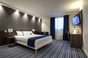 Postel nebo postele na pokoji v ubytování Holiday Inn Express Lille Centre by IHG