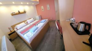 a bedroom with a large bed in a room at Hotel Gól Prostějov in Prostějov