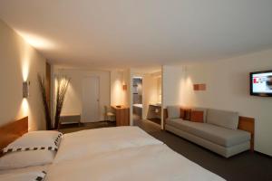 Voodi või voodid majutusasutuse Hotel Allalin Saas-Fee toas