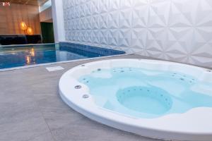 A piscina em ou perto de Nova Hotel