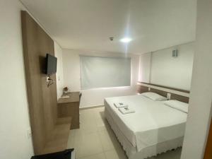 Postel nebo postele na pokoji v ubytování San Lucas Hotel