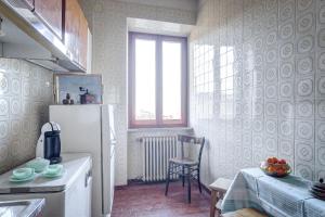 Kuchyň nebo kuchyňský kout v ubytování L’Arco + 36 fotografií