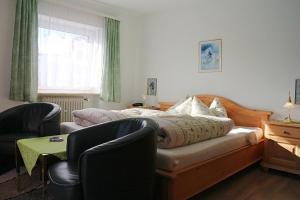 מיטה או מיטות בחדר ב-Hotel-Pension Thomé