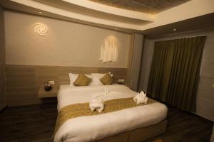 Voodi või voodid majutusasutuse Vastu Boutique Hotel toas