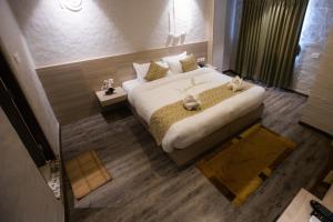 Voodi või voodid majutusasutuse Vastu Boutique Hotel toas